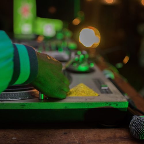 close-up-shot-of-dj-busy-with-turntable-with-micro-2025-01-08-02-38-56-utc-scaled-r445tjt4gmwdase1n7nsgo1m44yfv4atfsxancmwzs