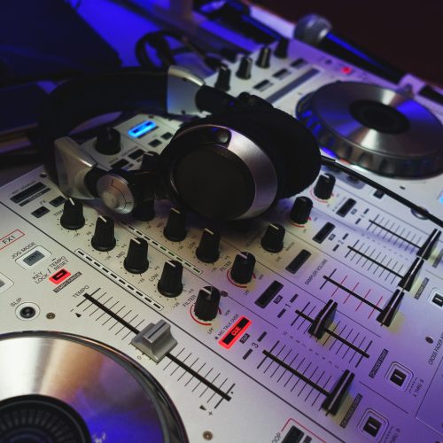 dj-mixer-in-bright-colors-disco-in-a-nightclub-2025-03-23-20-57-53-utc-scaled-r445u7b37hsjd1fwtztgp044yrqm7jw3v18fn9o2o8